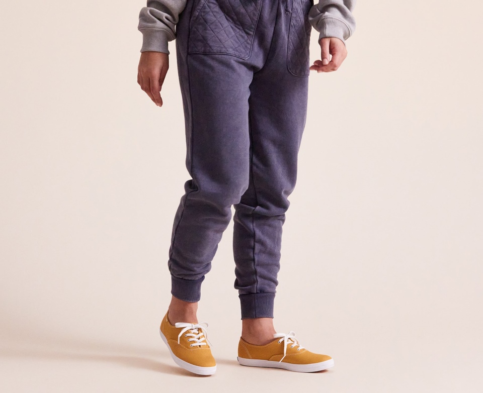 Keds Women\s Champion Algodão Orgânico Lona Colheita Ouro